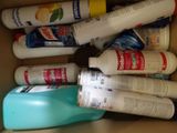 a cardboard box filled with different types of cleaning products