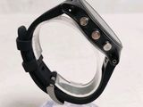 a close up of a watch on a clear stand