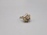 a close up of a gold ring with diamonds on it