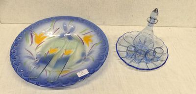 a blue plate and a glass bowl on a table