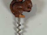 a picture of a bottle opener with a squirrel on it