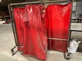 two red plastic sheets on a metal rack in a warehouse