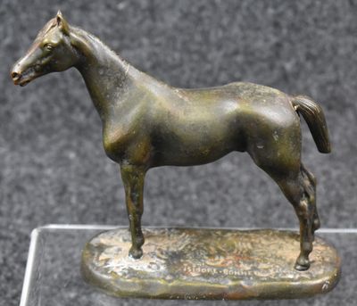 bronze statue of a horse on a clear base on a black background