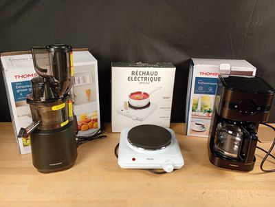 three different types of coffee makers on the table