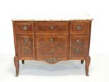 an antique chest of drawers with marble top and brass handles