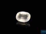 a white quartz stone on a black surface