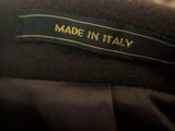 an image of a label on a jacket that says made in italy