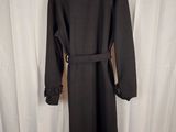 the back of a black coat with a belt on a mannequin mannequin mannequin mannequin mannequin mannequin mannequin