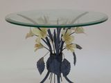 a glass table with flowers on it on a white background