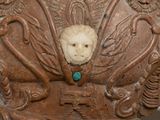 a statue with a face in the middle of it