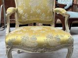 an old chair with a yellow upholstered upholstered upholstered upholstered upholstered