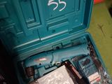 a blue tool box with tools in it on the floor