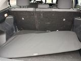 the back of a car with its trunk open and the seats folded down