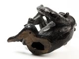 a sculpture of a bird that is sitting on a branch