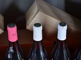 bottles of wine are lined up in a row on a table