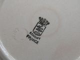 a close up of a plate with a crown on it