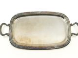 an antique silver plate with handles and handles on a white background