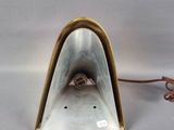 an image of a white and gold lamp with a brown cord