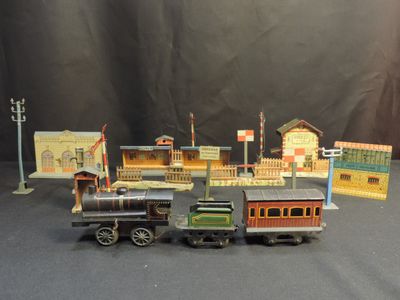 several toy trains are lined up on a black surface