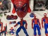 spider - man action figures and toys are displayed on a table