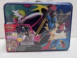 a close up of a tin box with a pokemon figure on it