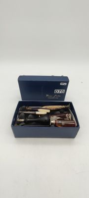 an open blue box with a knife and a knife sharper in it