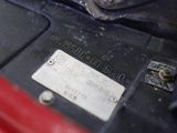 a close up of a motorcycle engine with a tag on it