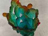 a glass bowl that has a bunch of birds in it