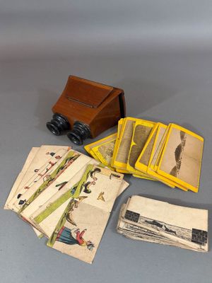 a small box of cards and a camera on a table
