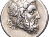 a close up of a coin with a man ' s face on it