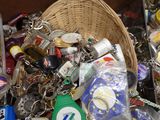 a basket full of key chains and other items
