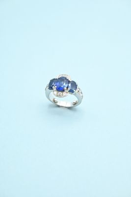 an image of a ring with a blue stone