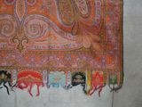 a picture of an orange and pink scarf on a table