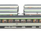a train that is sitting on the tracks in front of other train cars