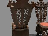 two chairs sitting next to each other on a gray surface