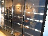 a glass display case in a store with a dog in it