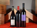 three bottles of wine sitting next to each other on a table