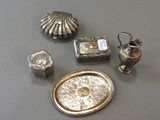 a lot of silver items that are on a table