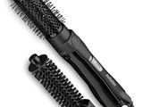 an image of a hair dryer and brush sitting next to each other
