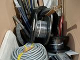 a cardboard box filled with various tools and supplies