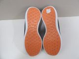 pair of orange and white slippers on a white surface
