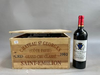 a bottle of wine in a wooden box next to a bottle of wine