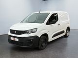 the white van is parked in a large room with a black floor