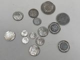 a lot of coins that are sitting on a table