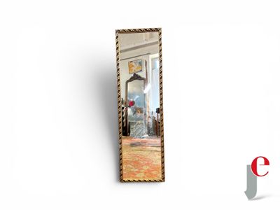a mirror that is hanging on the wall in the room