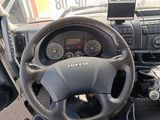dashboard of a truck with a steering wheel and gauges on it