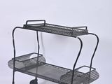 two tiered metal cart with wheels and a basket on top