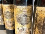 several bottles of wine are lined up on a table