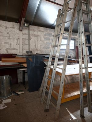 a ladder that is leaning against a wall in a room