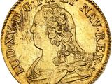 gros plan d'une pièce d'or sur laquelle figure une femme